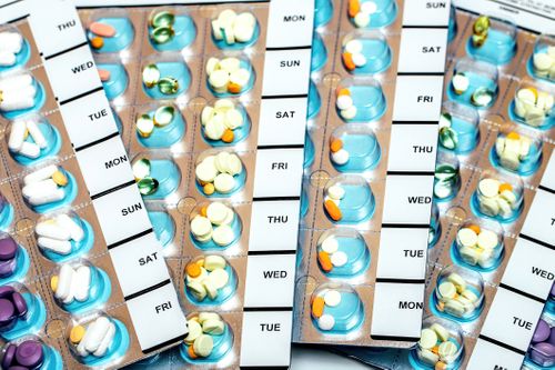 A pharmacist uses a mortar and pestle to compound medication PakMyMeds™ Multi-Dose Packaging